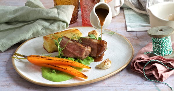 Cover Image for Lamb rump with pea purée, pot-roasted carrots and Dauphinoise potato